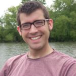 Matthew Fledderjohann smiles with a Lakeview behind him.