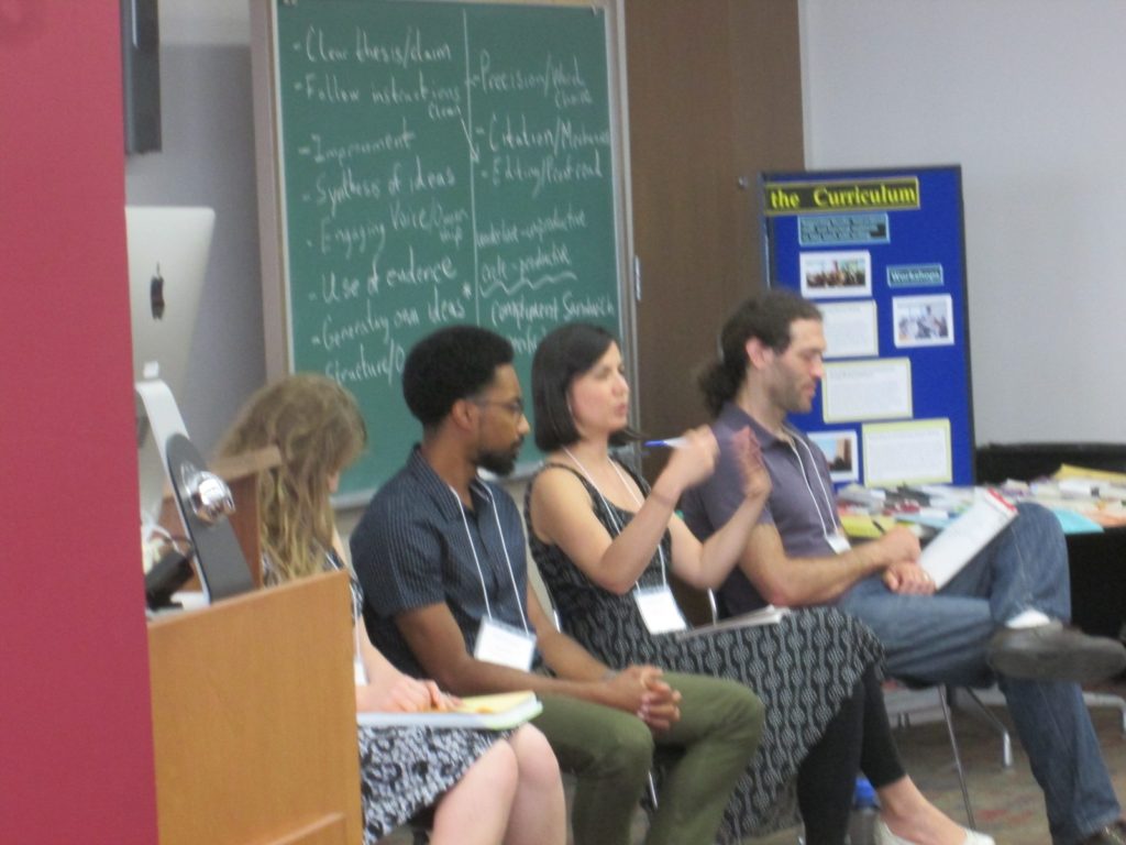Four teaching assistants from writing-intensive courses--Kayci Harris from History, Harvey Long from the Information School, Angela Serrano from Sociology, and Micah Kloppenberg from Biology--participate in a panel discussion as part of WAC training for c. 70 new writing-intensive TAs from across UW-Madison on August 27 and 28, 2018.