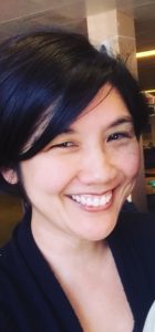 Taryn Okuma smiles.