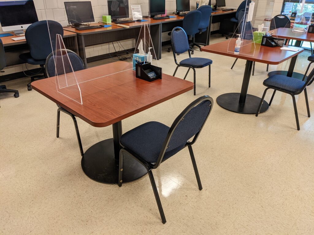 square-shaped tables with two chair in a row