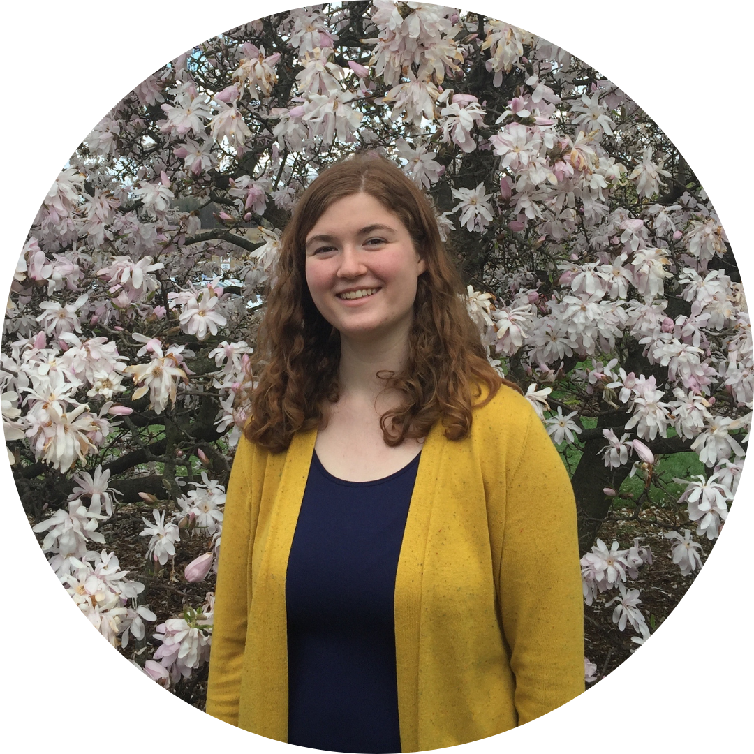 Allyson Mills in front of flowers