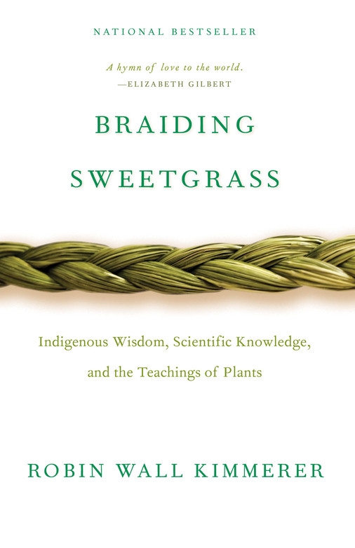  Robin Wall Kimmerer’s Braiding Sweetgrass book. Across the front is grass braided together on a white background