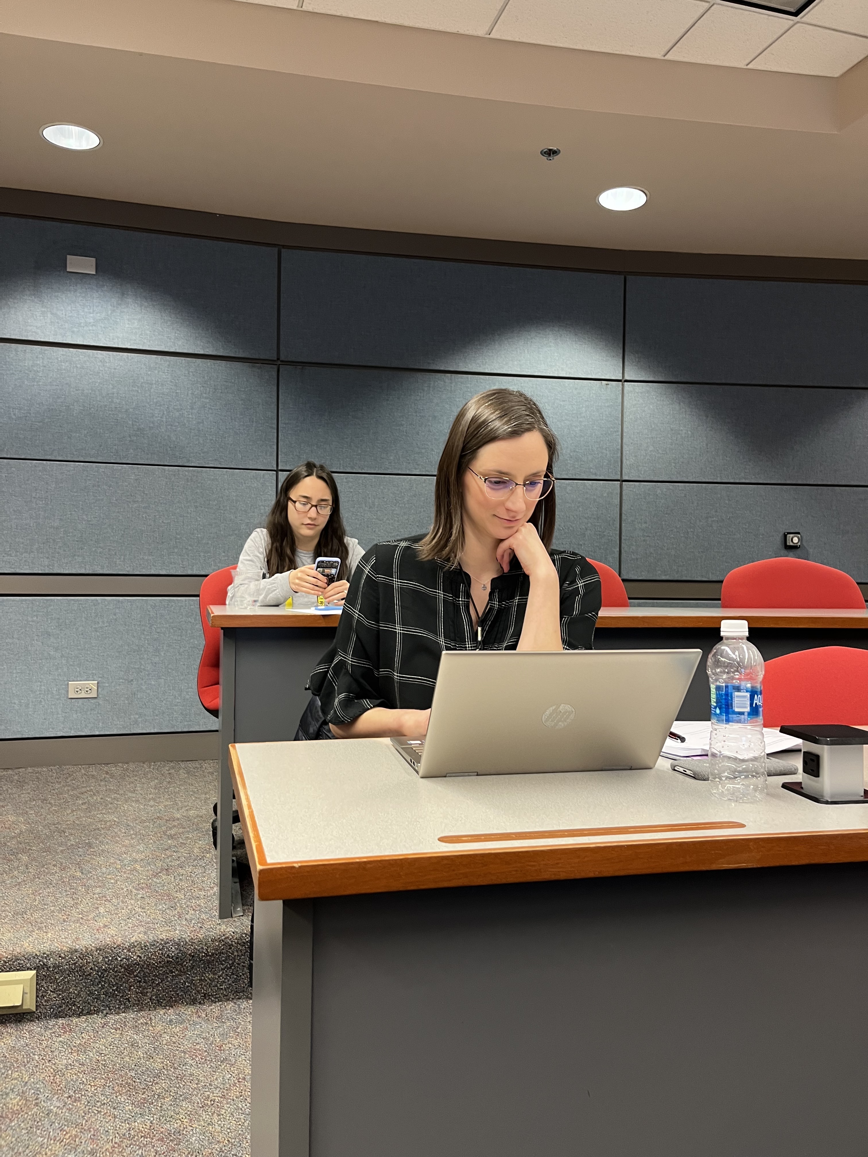 A contributor staring thoughtfully at her computer.