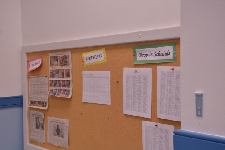 Bulletin board of achievements, birthdays, and schedules for the Writing Associates (WA’s) of the College Writing Program (CWP) found in the writing room