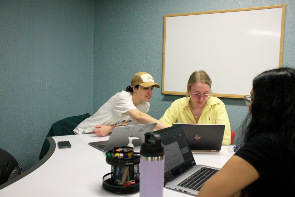 TUWC Staffer points out changes to help a student improve their writing.