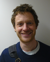 John Boonstra smiling against a white backdrop